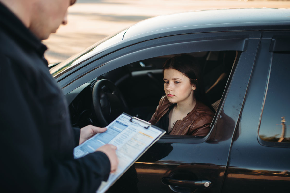 female driver stopped by a police officer